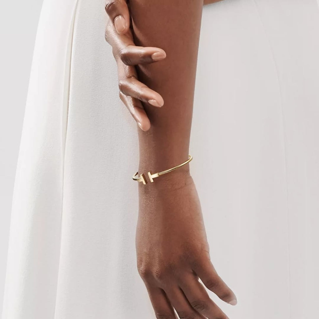 PULSERA T DORADA